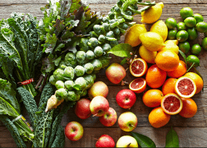 a group of fruits and vegetables on a wood surface Healthy Weight Loss Diets Glenrothes